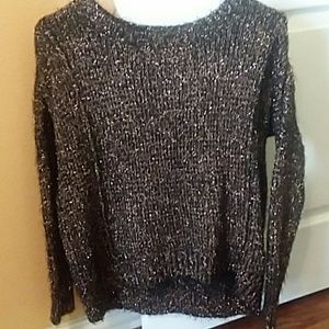 Jennifer Lopez black and gold sweater